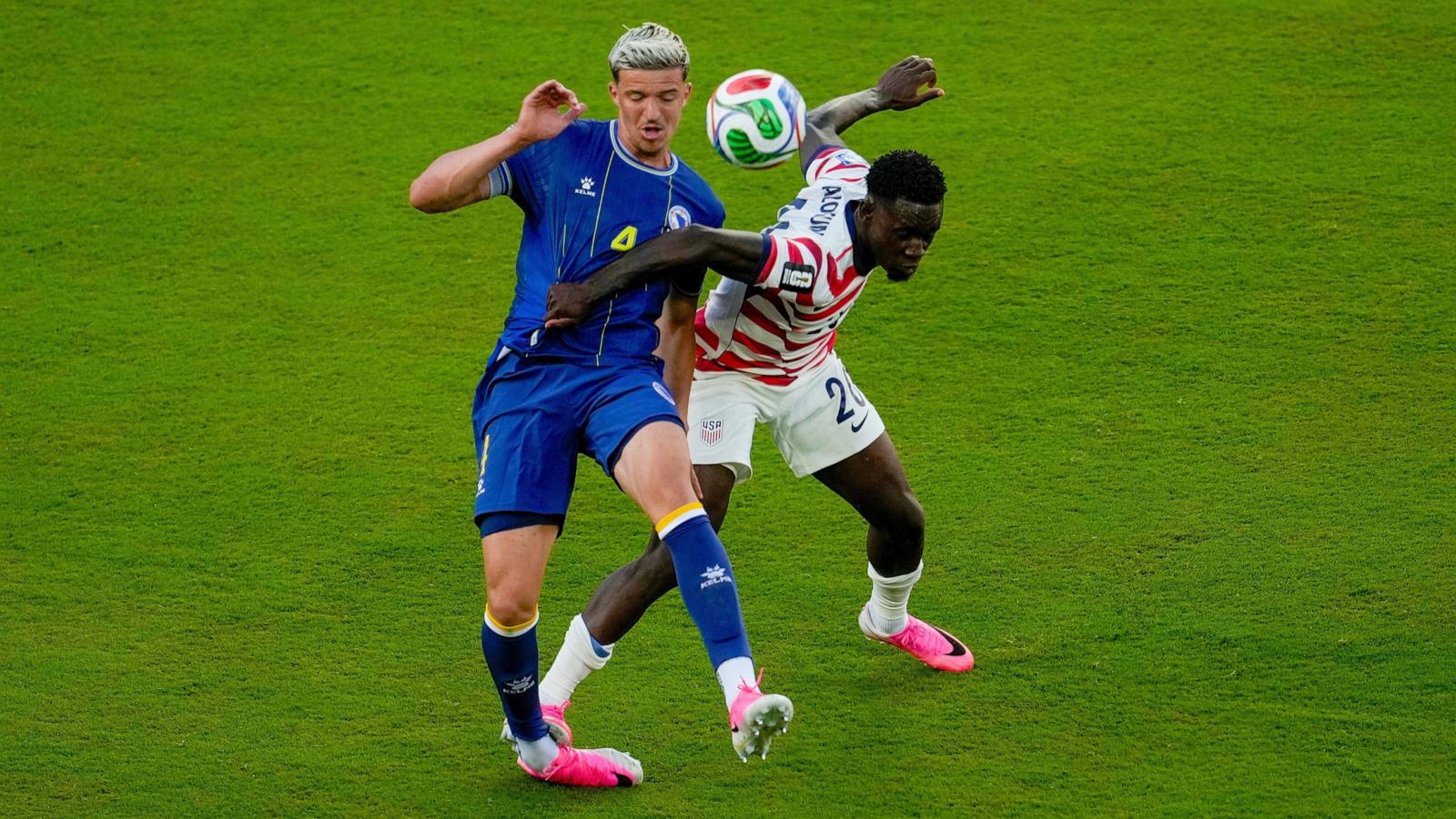 PHOTO: United States' Folarin Balogun fouls Bosnia's Tarik Muharemovic during their FIFA World Cup 2026 round of 32 soccer match in Santa Clara, Calif., July 1, 2026.