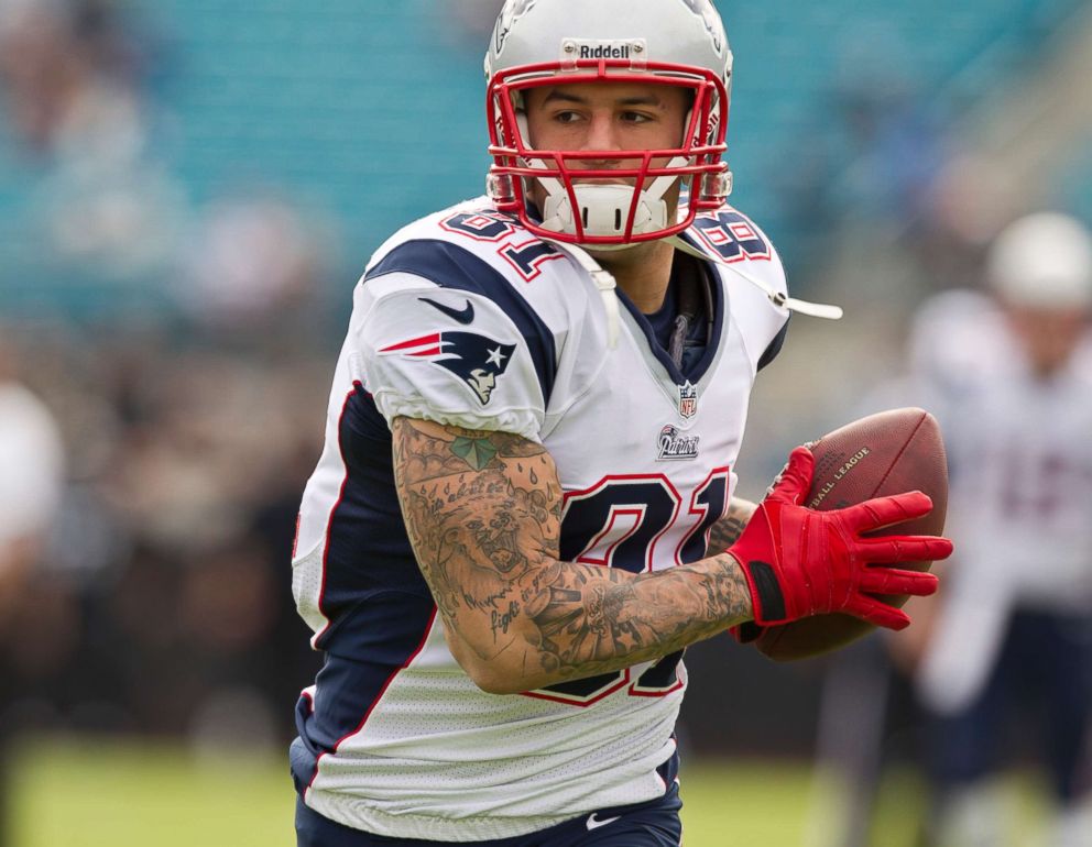 PHOTO: New England Patriots player Aaron Hernandez makes a catch during war...