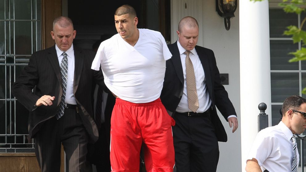 PHOTO: New England Patriots tight end Aaron Hernandez was arrested and led out of his home in handcuffs, on June 26, 2013, North Attleborough, Mass. 