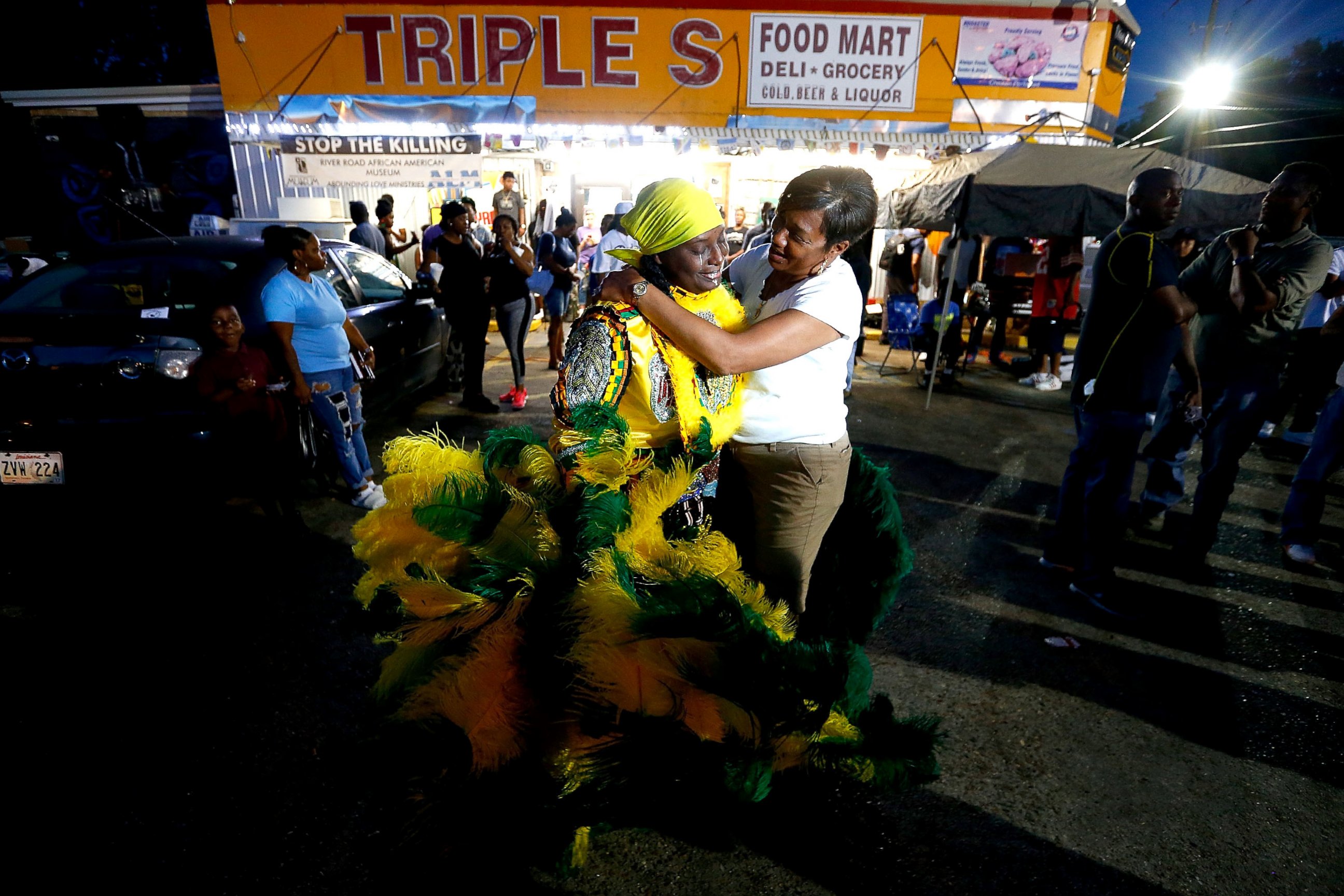 PHOTO: Members of the community stand in front of the Triple S Food Mart, on May 2, 2017, in Baton Rouge, Louisiana.