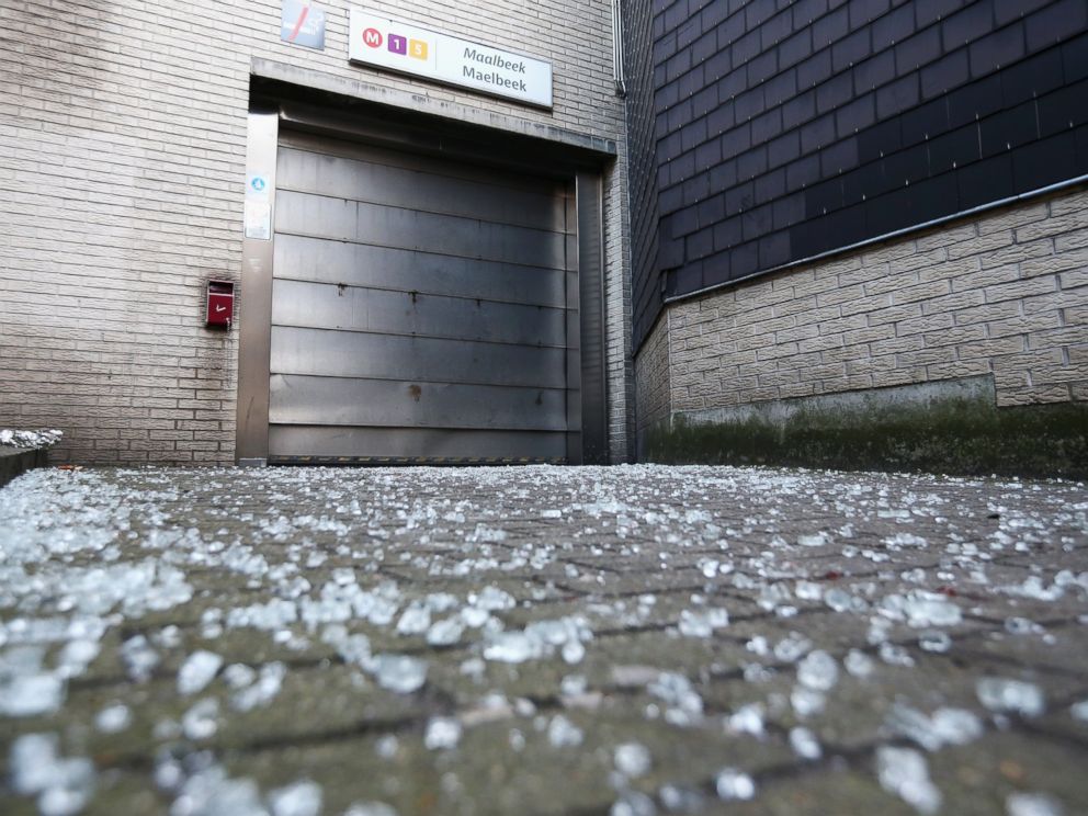 PHOTO: Broken glass is seen outside an entrance to Maelbeek metro station following the attacks on March 22, 2016 in Brussels, Belgium.