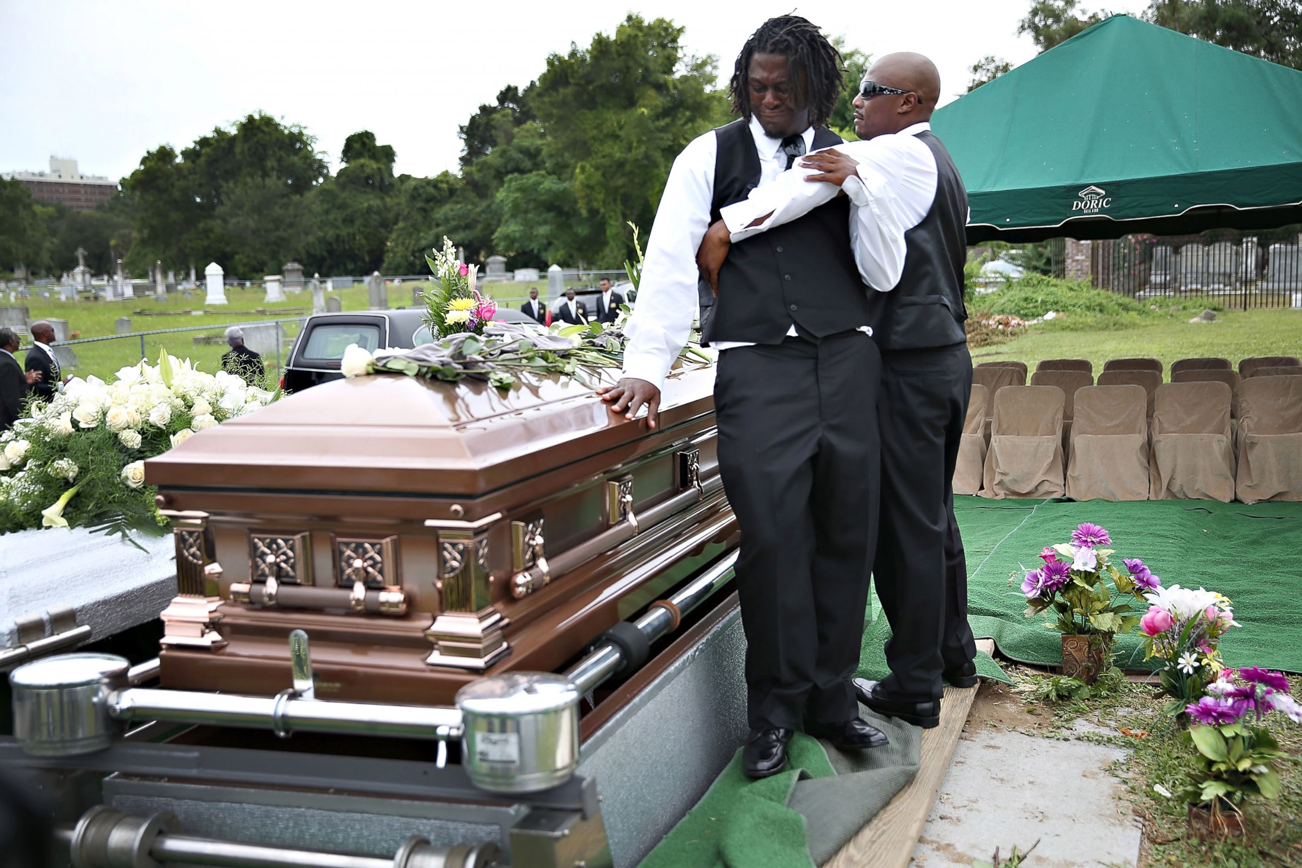 PHOTO: Brandon Risher, left, is comforted beside the casket of his grandmother, Ethel Lance, 70, one of nine victims of a mass shooting at the Emanuel AME Church, June 25, 2015 in North Charleston, South Carolina. 