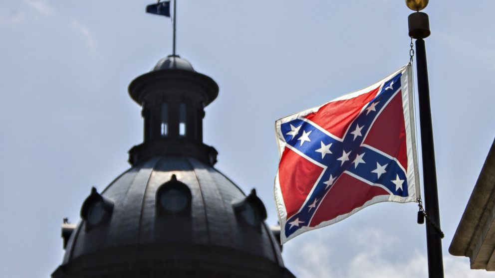 The Confederate Battle Flag flies in front of the South Carolina House in the state capitol, June 25, 2015, in Columbia, S.C. before it was taken down after the deadly shooting at Emanuel African Methodist Episcopal Church by Dylann Roof.