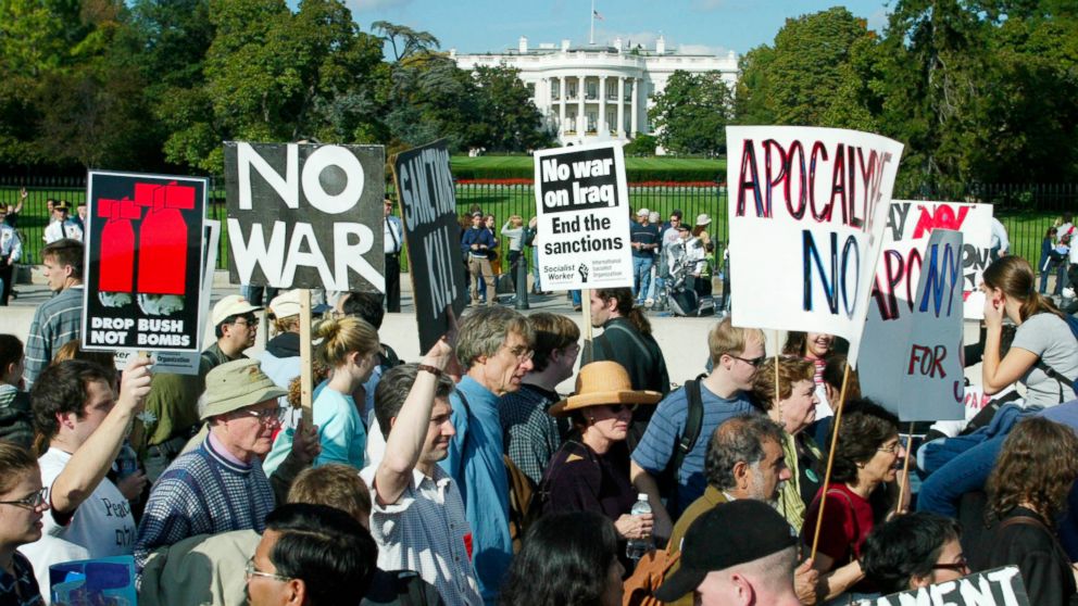PHOTO: Anti war protestors march past the White House in Washington, DC on October 26, 2002 to protest President George W. Bush's policy advocating war against Iraq. Washington police estimated the crowds to be as large as 50,000. 
