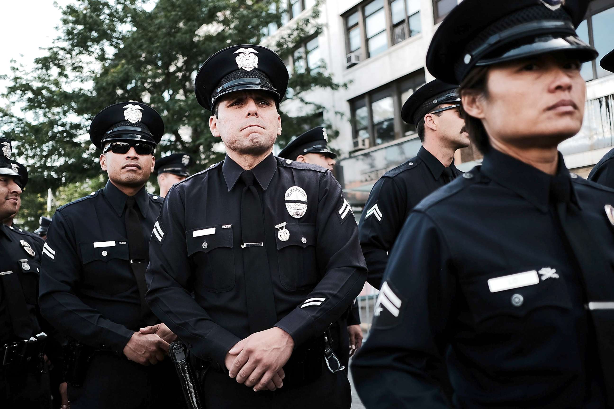 PHOTO: Police from Los Angeles stand outside of a Bronx church during the funeral for NYPD Officer Miosotis Familia, who was shot and killed last week in what police have called "an unprovoked attack" in the Bronx, on July 11, 2017, in New York City.