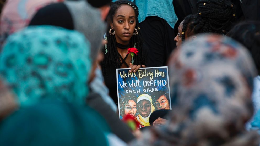 PHOTO: People hold up signs during a vigil in Washington, on June 20, 2017, for Nabra Hassanen, a 17-year old Muslim girl that was killed in a road rage incident on June 18. 