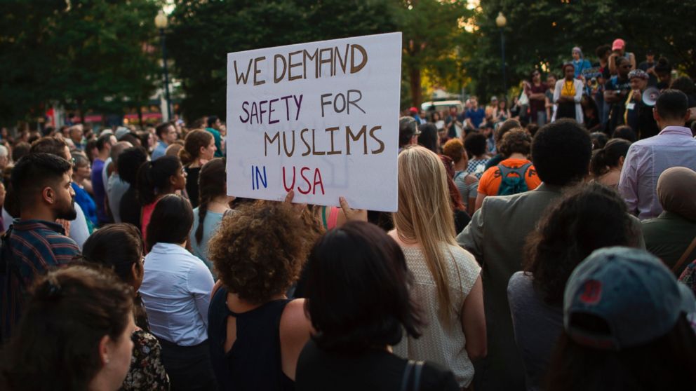 PHOTO: People hold up signs during a vigil in Washington, on June 20, 2017, for Nabra Hassanen, a 17-year old Muslim girl that was killed in a road rage incident on June 18.

