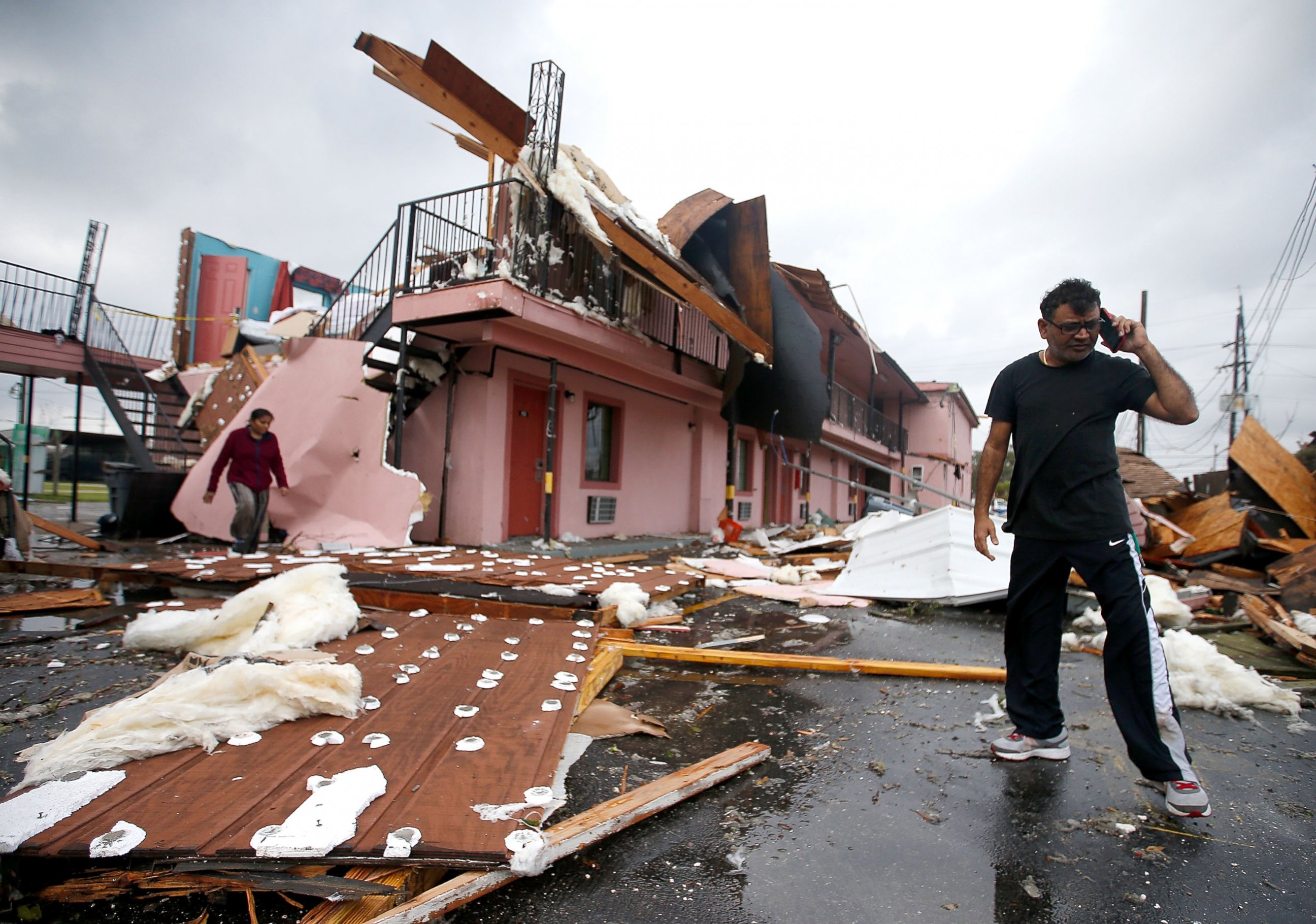 PHOTO: A man walks through the debris of what was once a motel on Chef Menture Ave after a tornado touched down on Feb. 7, 2017 in East New Orleans, Louisiana.