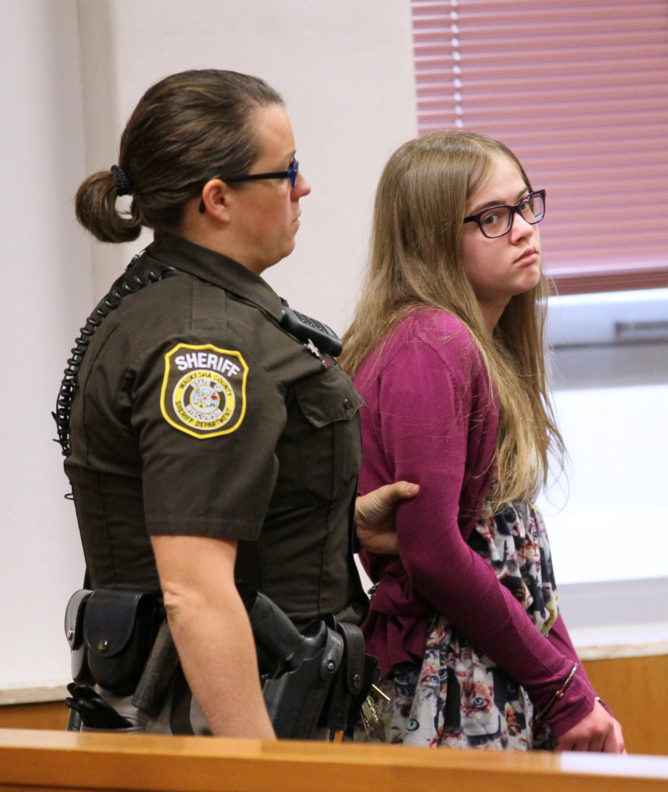 PHOTO: Morgan Geyser is brought into court by a sheriff's deputy on Aug. 21, 2015 during the arraignment of the Slenderman stabbing trial in Waukesha County Court in Waukesha, Wisconsin. 