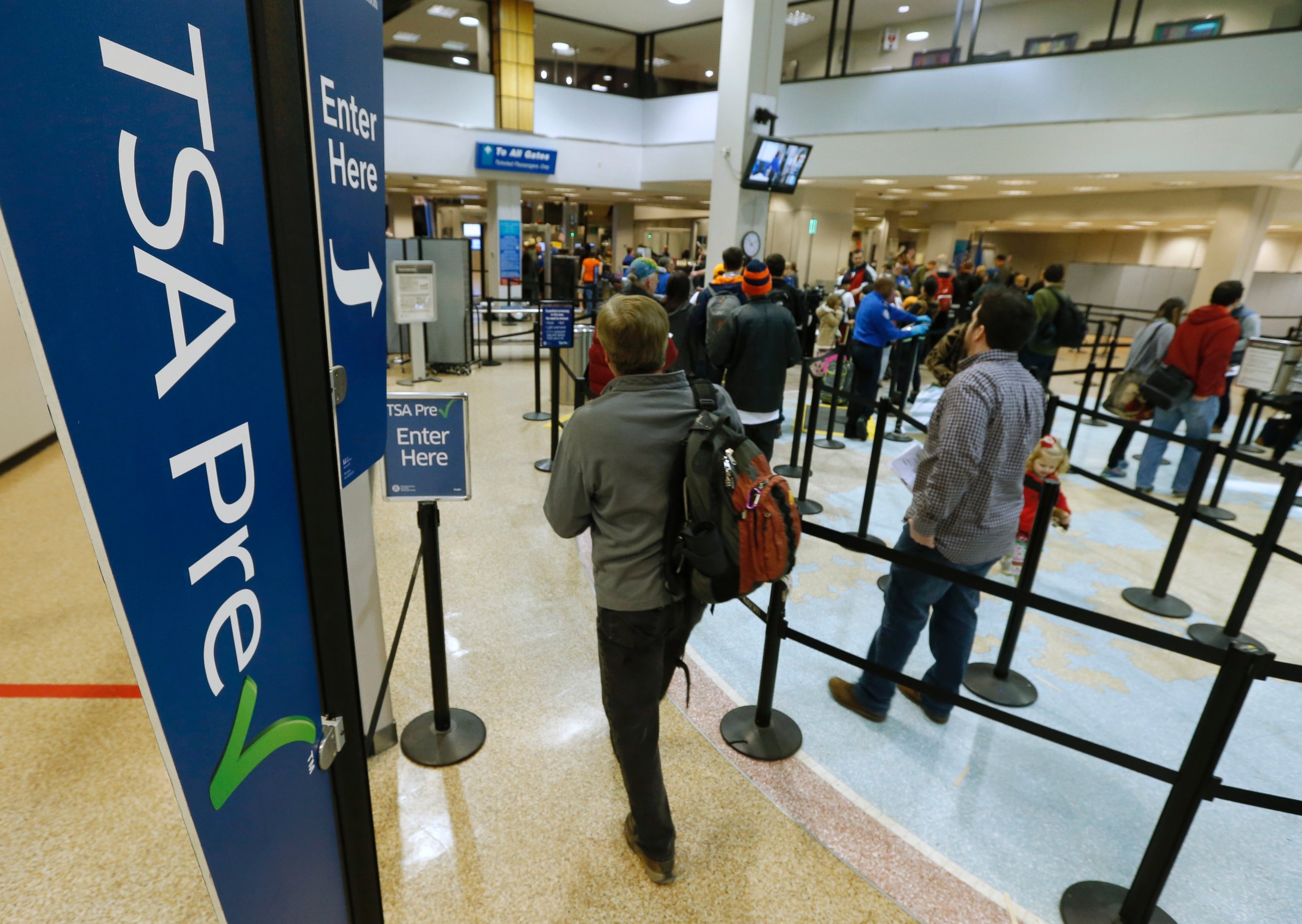 PHOTO: A passenger enters the Transportation Security Administration (TSA) pre-check line towards a security check point at Salt Lake City International Airport in Salt Lake City, on Dec. 23, 2014. 