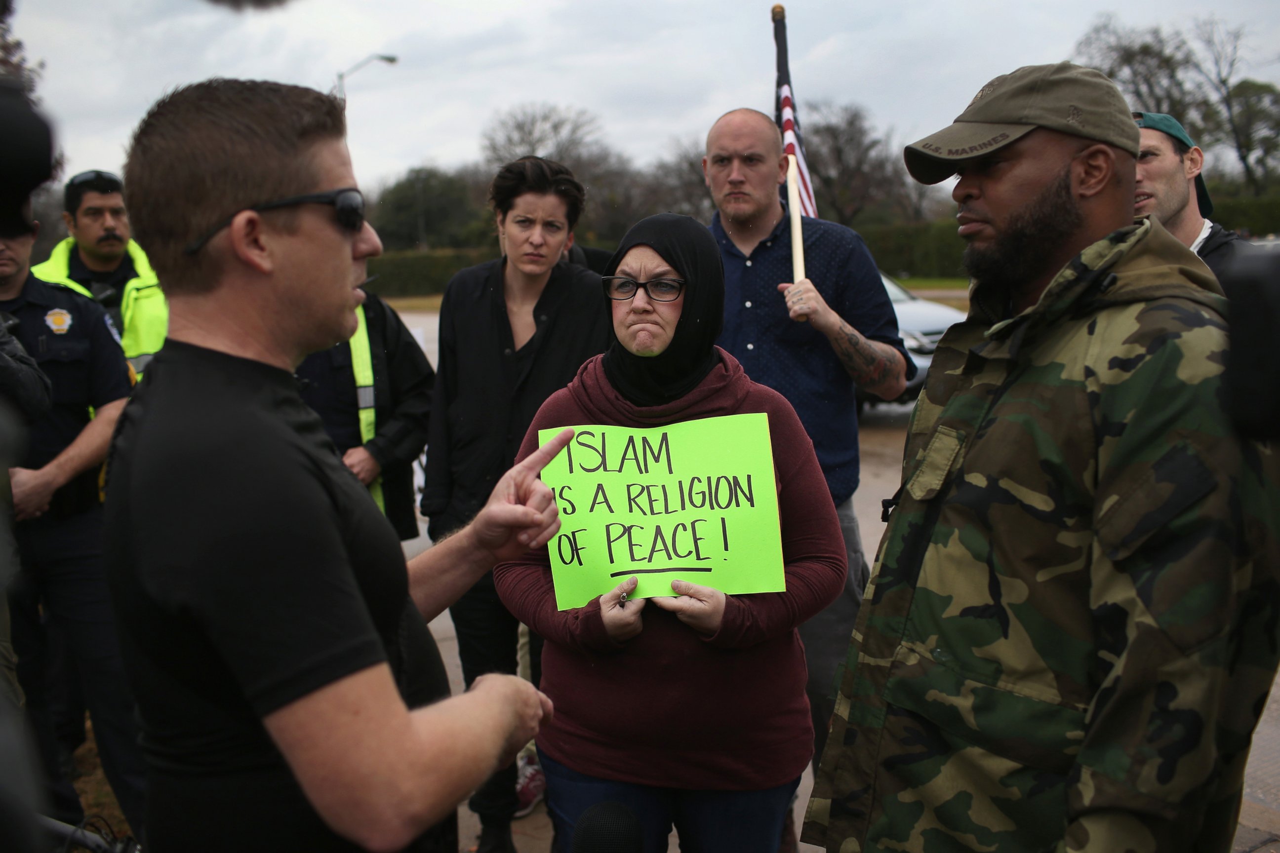 PHOTO: Protest leader David Wright, from the so-called Bureau of American-Islamic Relations (BAIR), speaks with a counter-demonstrator in front of the Islamic Association of North Texas at the Dallas Central Mosque, Dec. 12, 2015, in Richardson, Texas. 