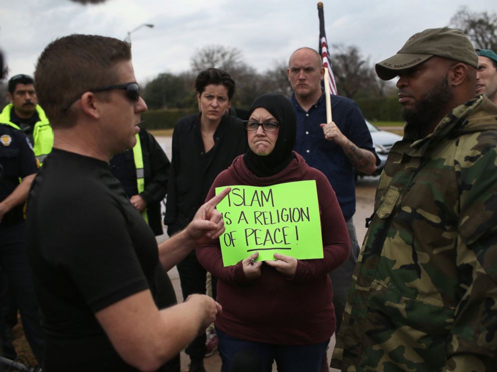 PHOTO: Protest leader David Wright, from the so-called Bureau of American-Islamic Relations (BAIR), speaks with a counter-demonstrator in front of the Islamic Association of North Texas at the Dallas Central Mosque, Dec. 12, 2015, in Richardson, Texas.