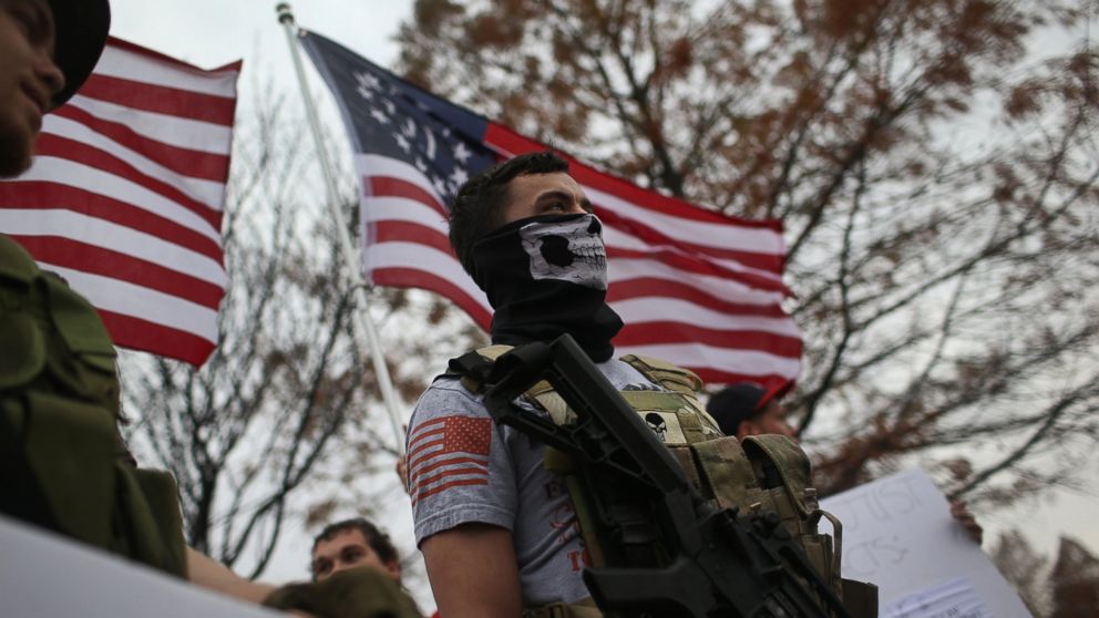 PHOTO: Armed protesters from the Bureau of American-Islamic Relations (BAIR), stage a demonstration in front of the Islamic Association of North Texas at the Dallas Central Mosque, Dec. 12, 2015, in Richardson, Texas.