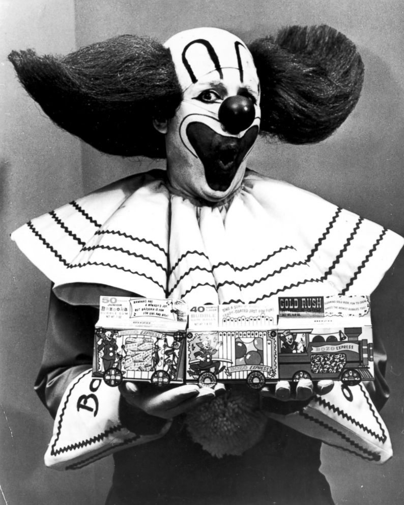 PHOTO: Bozo the Clown holding boxes of Bozo Express Bazooka bubble gum, circa 1965.