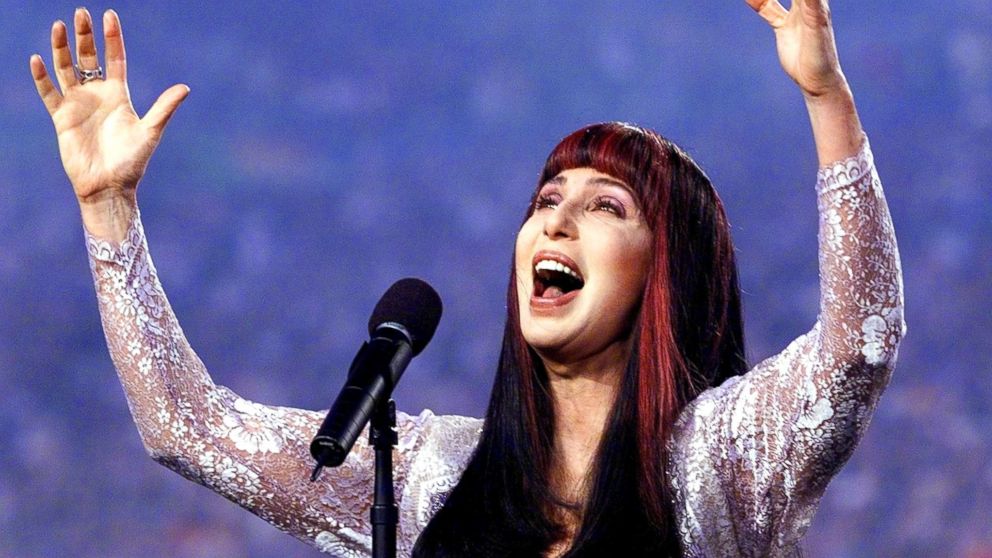 PHOTO: Cher sings the "Star Spangled Banner" before the start of Super Bowl XXXIII, Jan. 31, 1999, at Pro Player Stadium in Miami. 