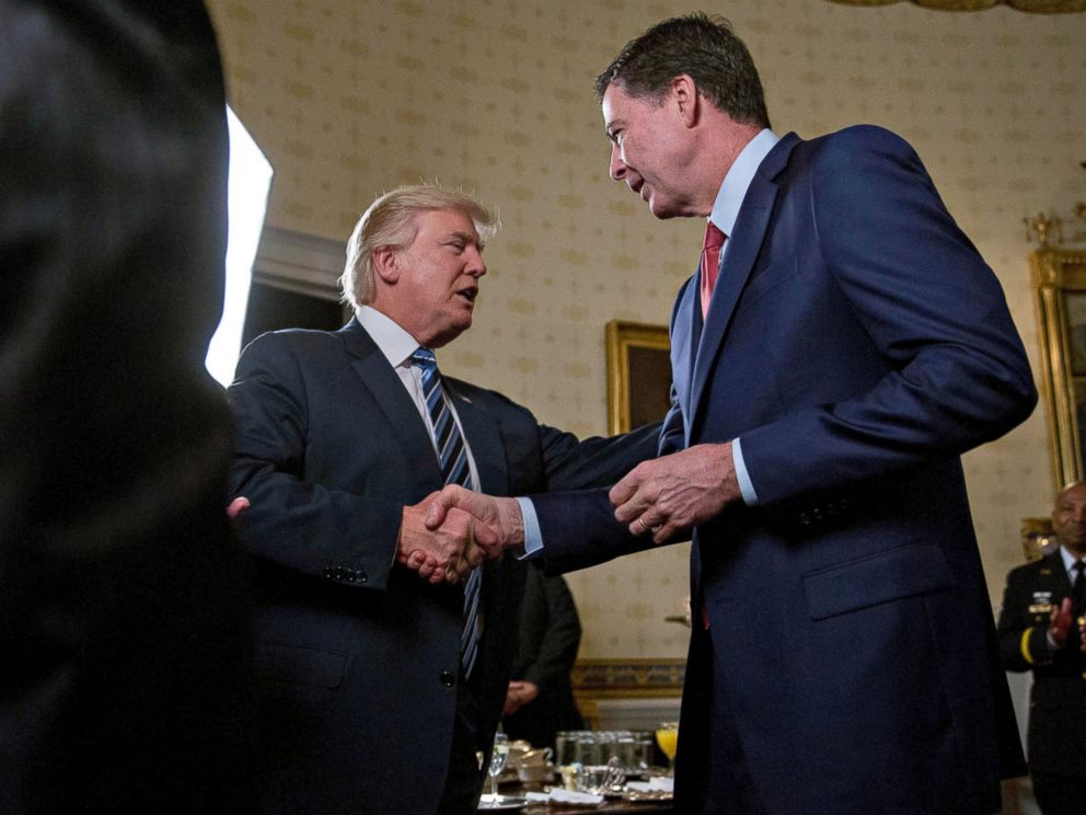 PHOTO: President Donald Trump shakes hands with James Comey, director of the Federal Bureau of Investigation, during an Inaugural Law Enforcement Officers and First Responders Reception in the Blue Room of the White House, Jan. 22, 2017, in Washington.