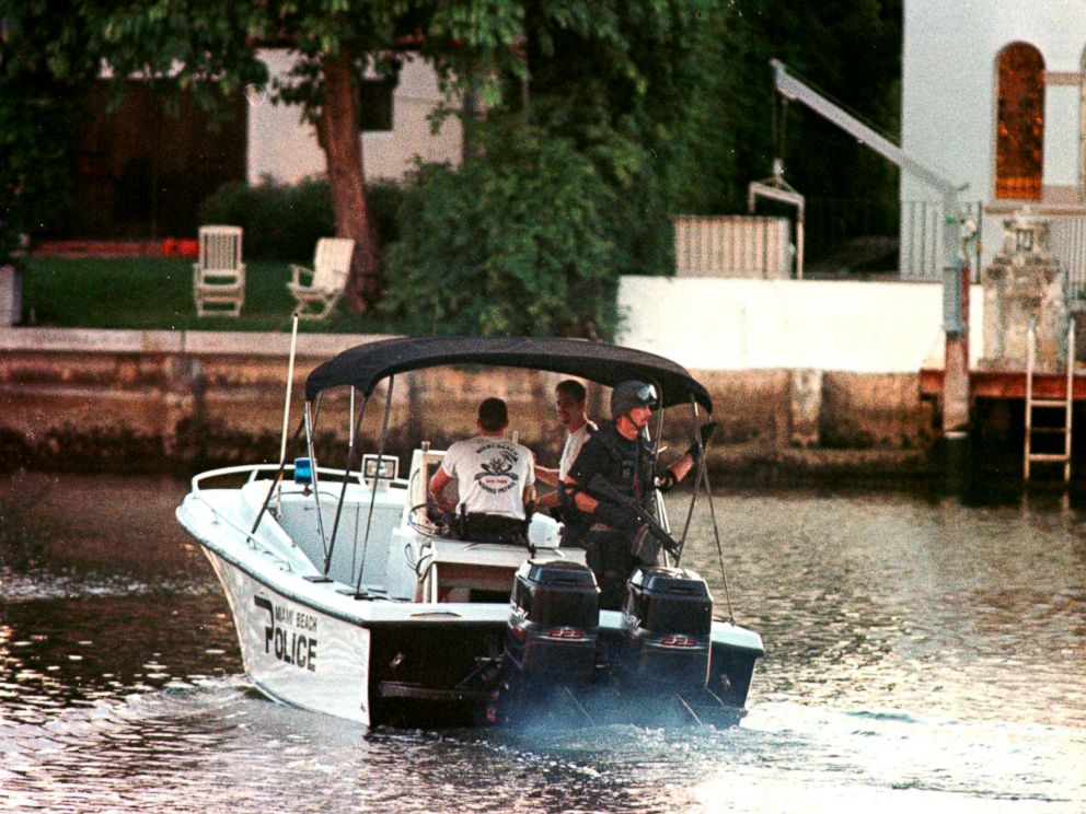 PHOTO: A member of the Miami Beach police SWAT team patrols a canal in the vicinity of a houseboat in Miami Beach, Fla., July 23, 1997, after it was reported that an unknown person was seen inside by the houseboats caretaker.