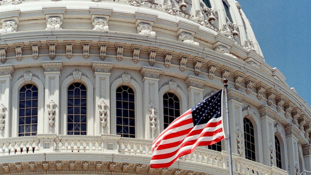 A United States Flag Flies On The Capitol Building In Washington, June 22, 1999.