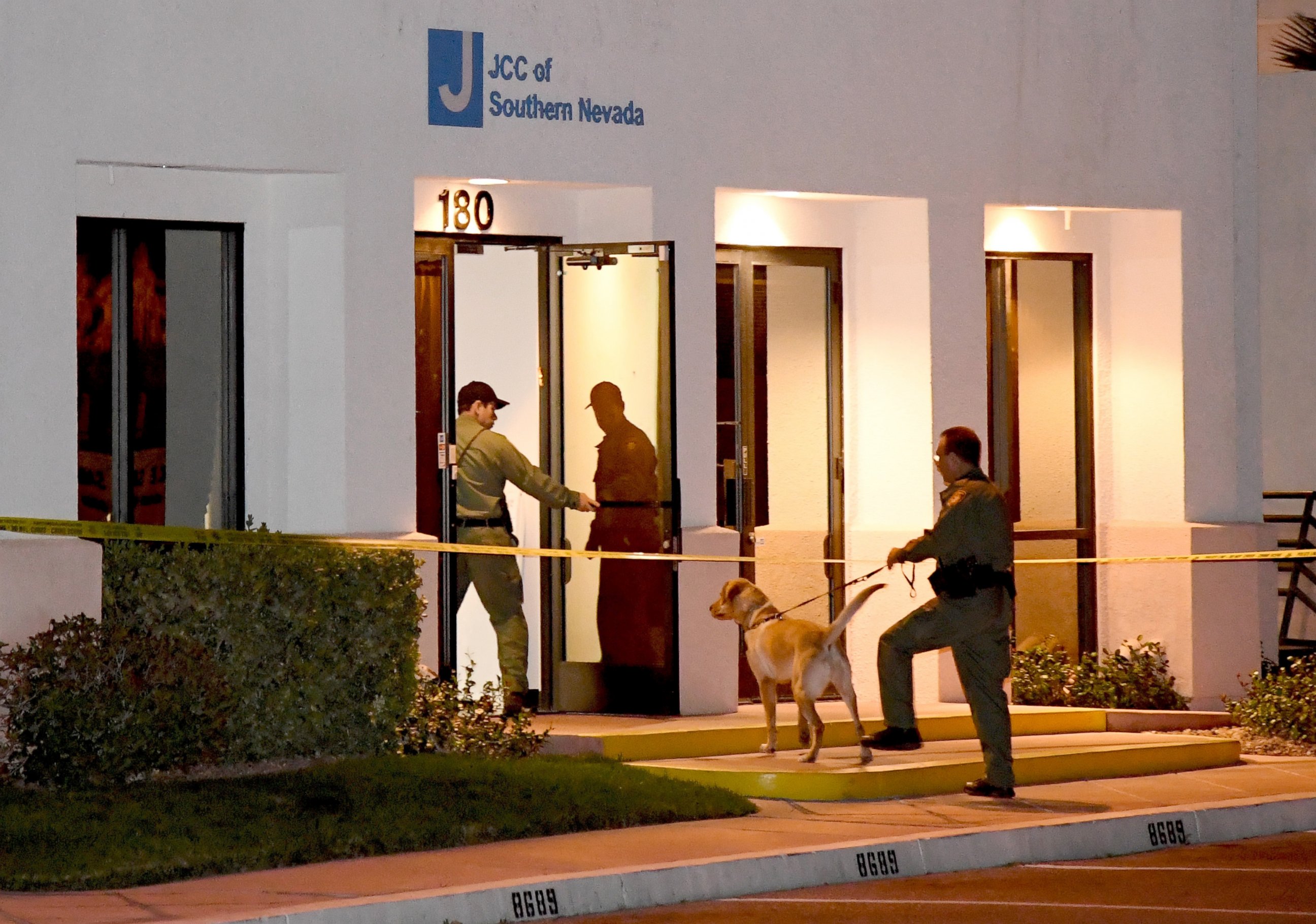 PHOTO: Las Vegas Metropolitan Police Department K-9 officers search the Jewish Community Center of Southern Nevada after an employee received a suspicious phone call that led people to evacuate the building, Feb. 27, 2017, in Las Vegas, Nevada. 
