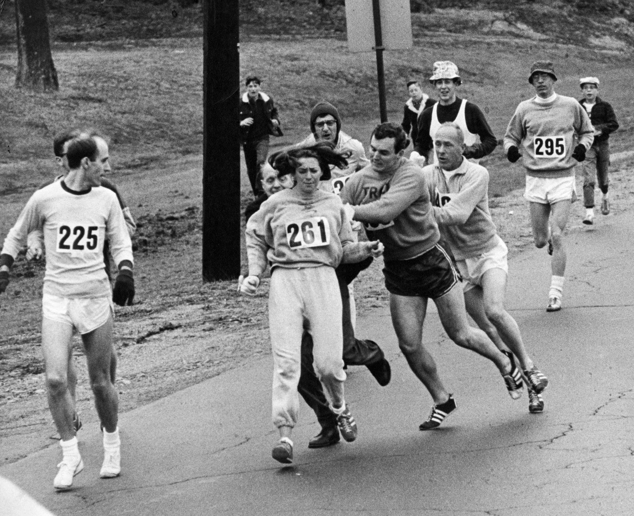 PHOTO: Kathrine Switzer, center, was spotted early in the Boston Marathon by Jock Semple, center right, who tried to rip the number off her shirt and remove her from the race, April 19, 1967.