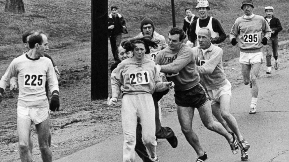 PHOTO: Kathrine Switzer, center, was spotted early in the Boston Marathon by Jock Semple, center right, who tried to rip the number off her shirt and remove her from the race, April 19, 1967.