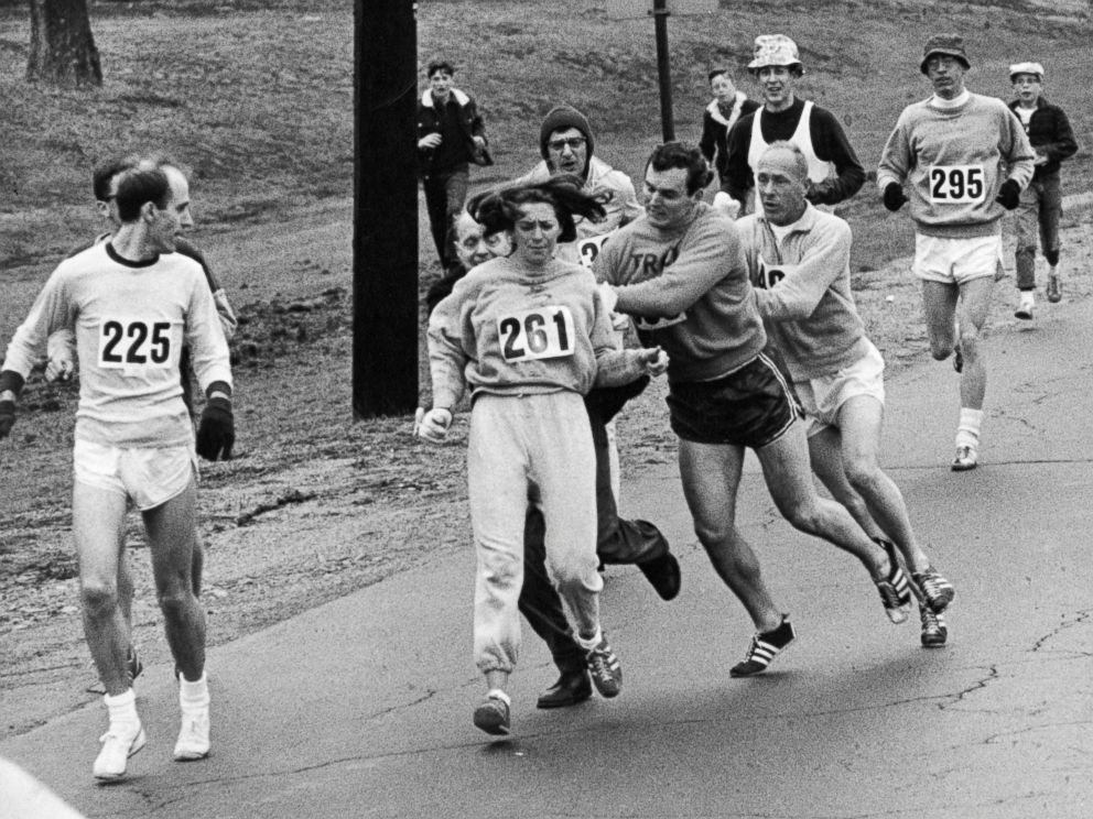 PHOTO: Kathrine Switzer, center, was spotted early in the Boston Marathon by Jock Semple, center right, who tried to rip the number off her shirt and remove her from the race, April 19, 1967.