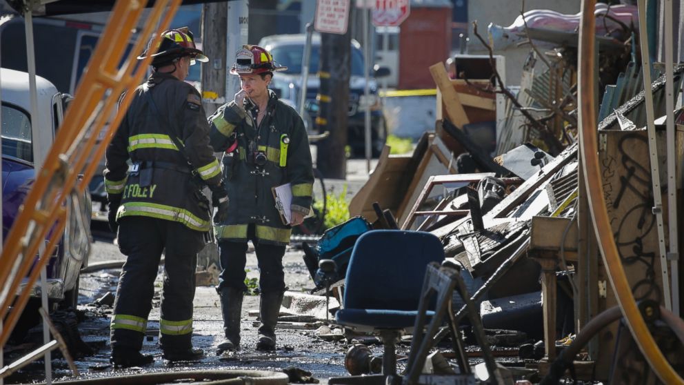 Firefighters work on the scene following an overnight fire that claimed the lives of at least nine people at a warehouse in the Fruitvale neighborhood, Dec. 3, 2016 in Oakland, California.