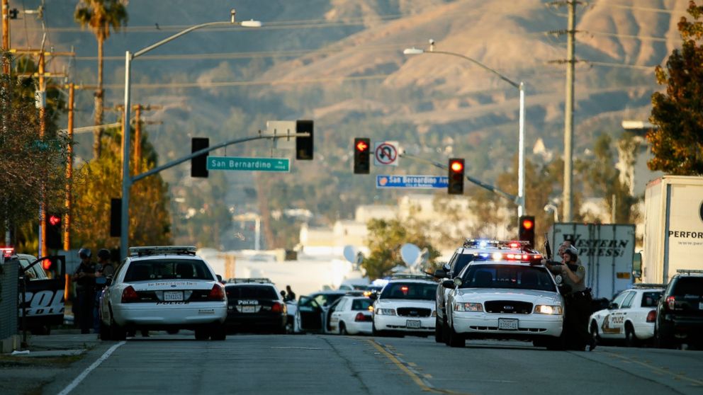 Law enforcement officers close Mountain View Avenue during the pursuit of suspects in the shooting  at the Inland Regional Center, Dec. 2, 2015, in San Bernardino, California.