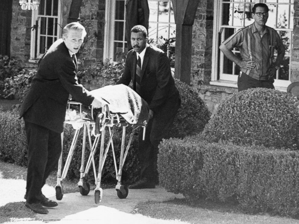 PHOTO: Coroner's office personnel wheel the body of film actress Sharon Tate from her home in Bel Air, Calif., August 9, 1969, after she and four others were found murdered. 