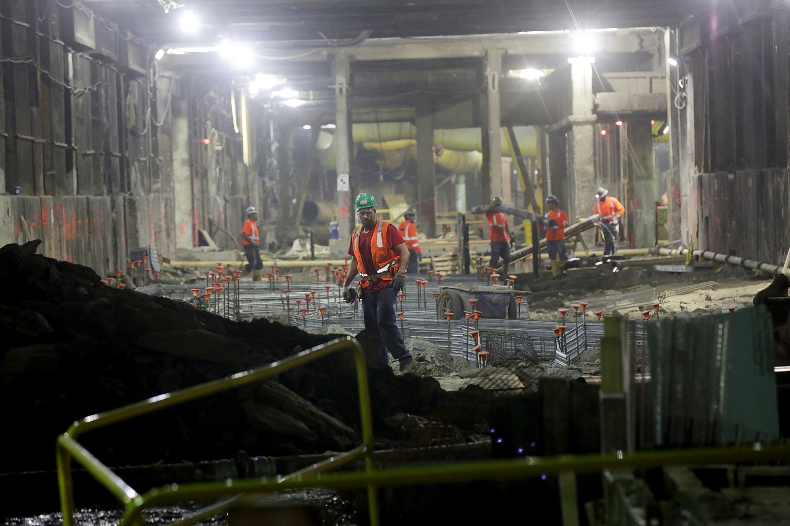 PHOTO: Workers stand in a tunnel in the East Side Access project, one of the largest transportation infrastructure projects currently underway in the United States, Nov. 4, 2015, in New York City.