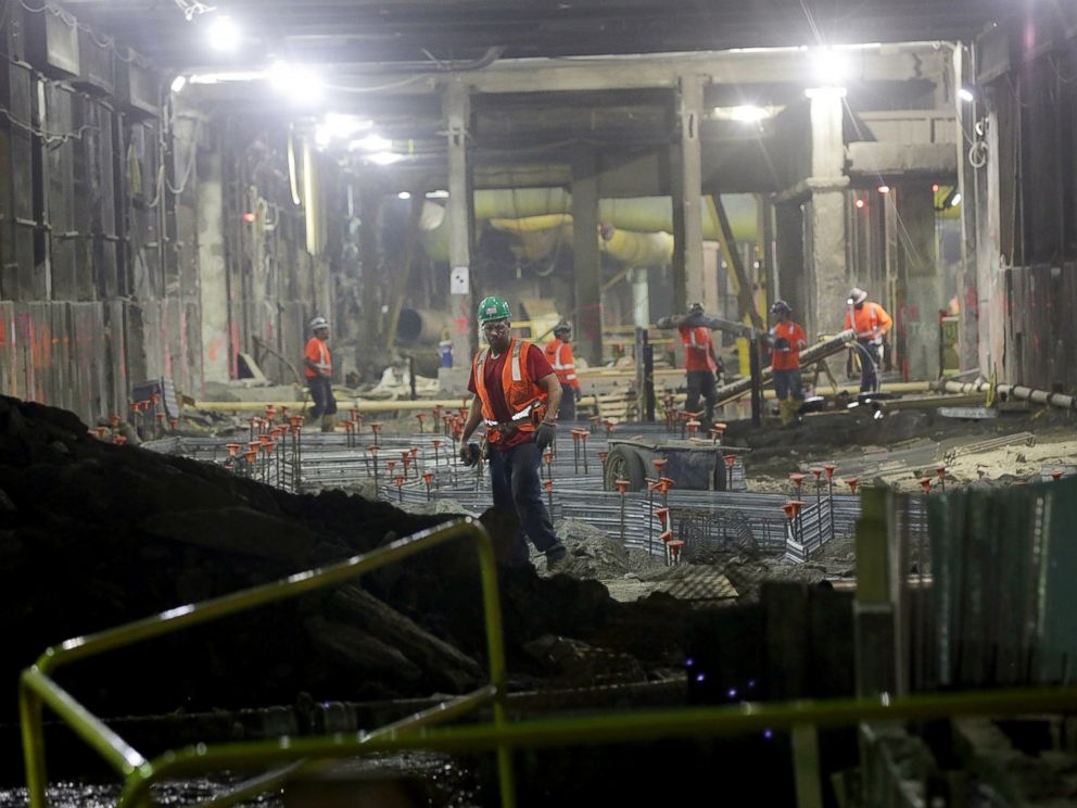 PHOTO: Workers stand in a tunnel in the East Side Access project, one of the largest transportation infrastructure projects currently underway in the United States, Nov. 4, 2015, in New York City.