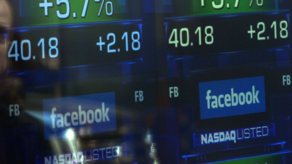 PHOTO: Screens display the start of trading in Facebook shares at the NASDAQ stock exchange in Times Square in New York, May 18, 2012.