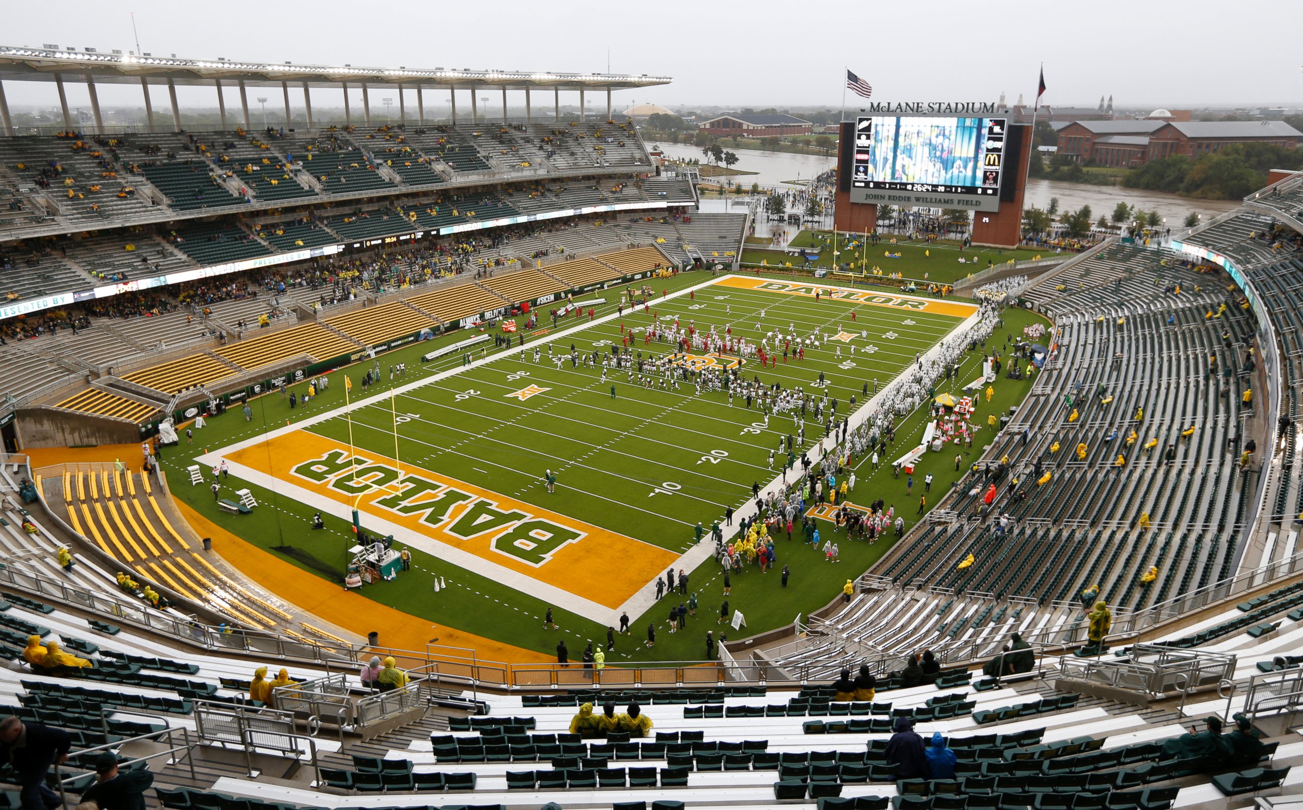 PHOTO: The swollen Brazos River runs just behind the playing field at McLane Stadium on Oct. 24, 2015 in Waco, Texas. 