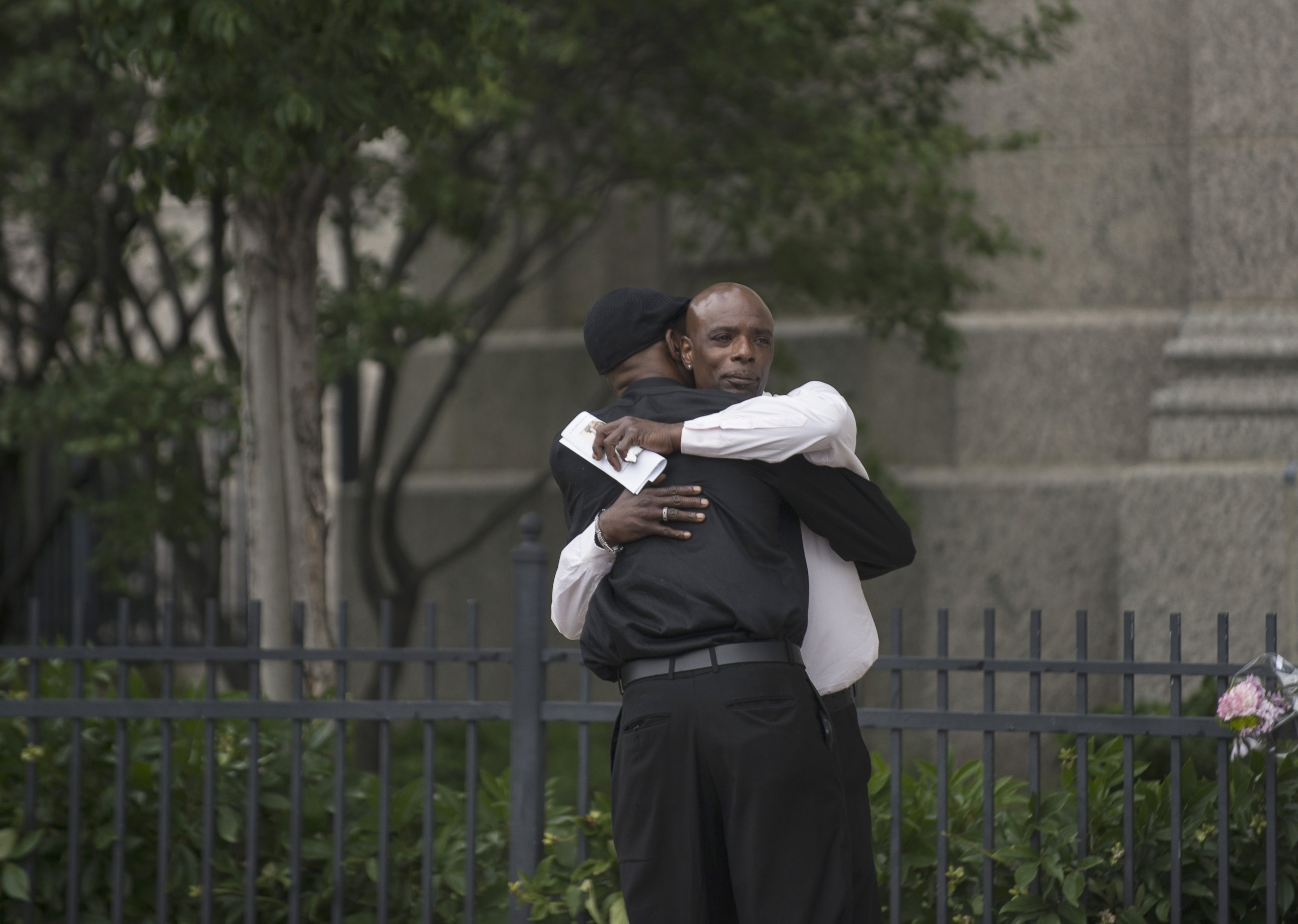 PHOTO: Two men embrace outside the funeral of Philando Castile at the Cathedral of St. Paul, on July 14, 2016, in St. Paul, Minnesota. 