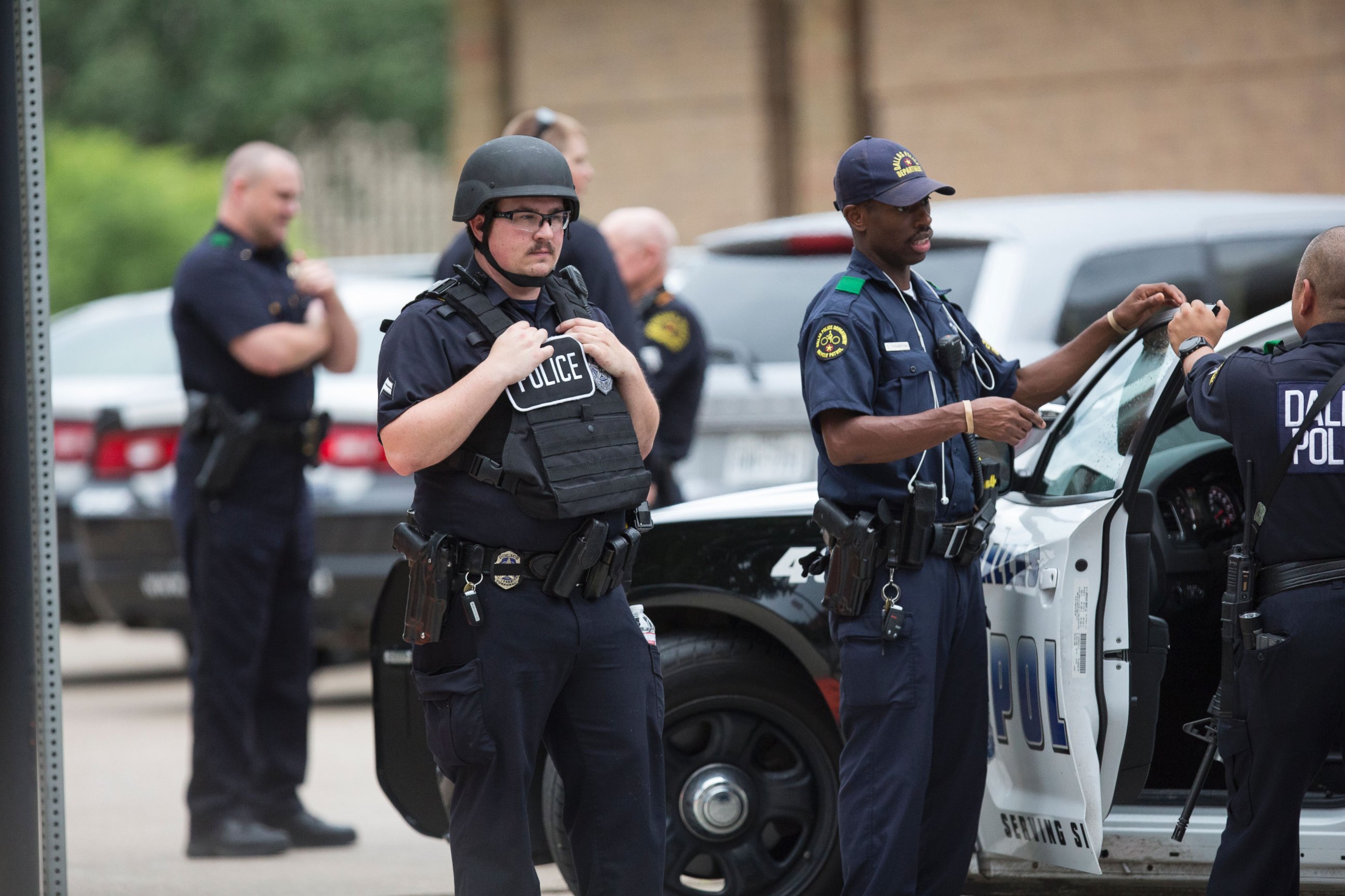 PHOTO: Police patrol the scene as Police Headquarters is in lockdown due to a threat in Dallas, on July 9, 2016.