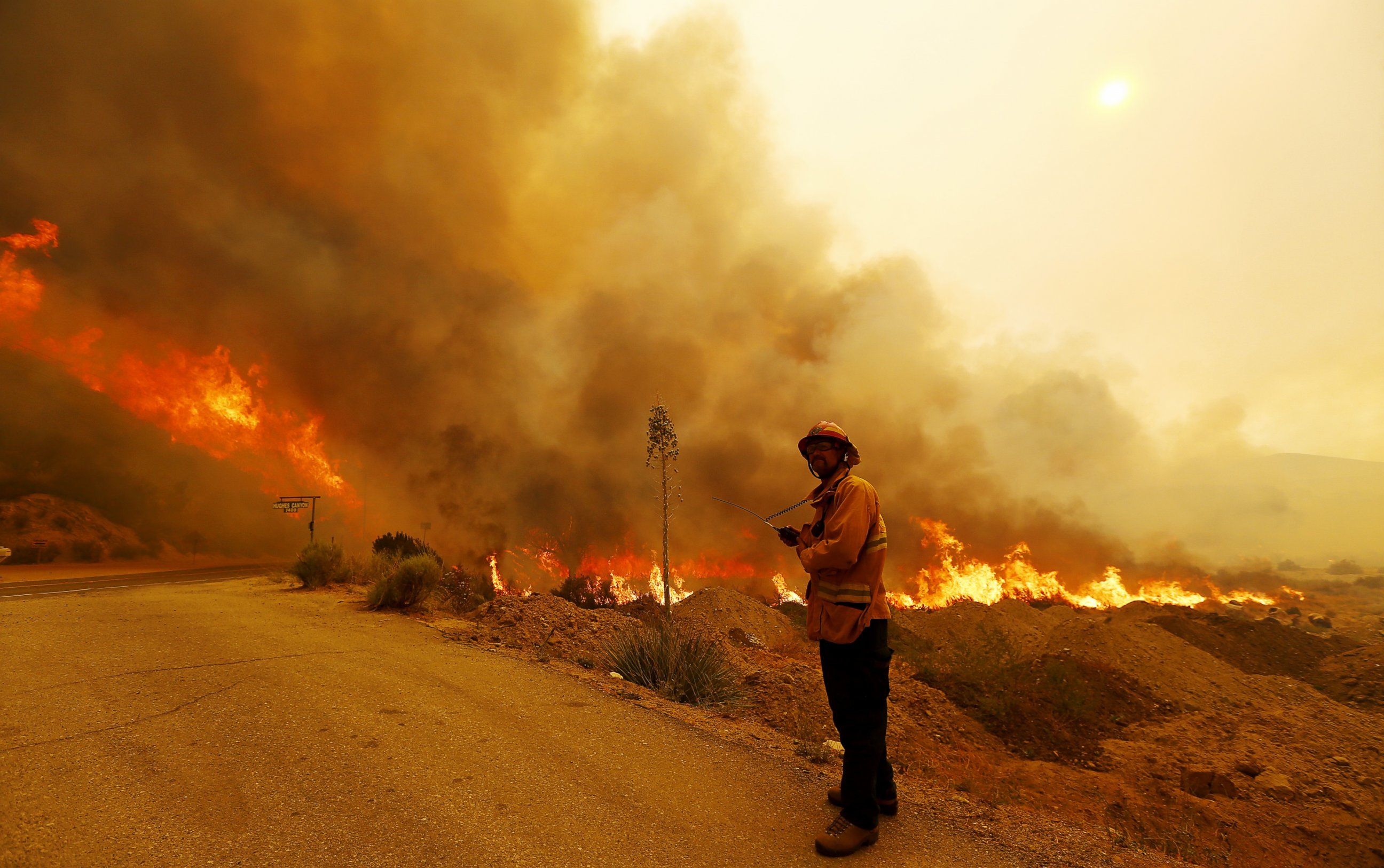 PHOTO: A firefighter keeps watch on the path of the Sand fire as it burns out of control along Soledad Canyon Road near Acton on July 24, 2016. 