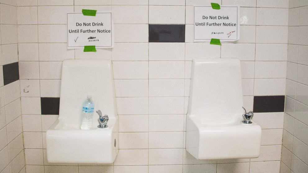 Placards posted above water fountains warn against drinking the water at Flint Northwestern High School in Flint, Mich. May 4, 2016. 