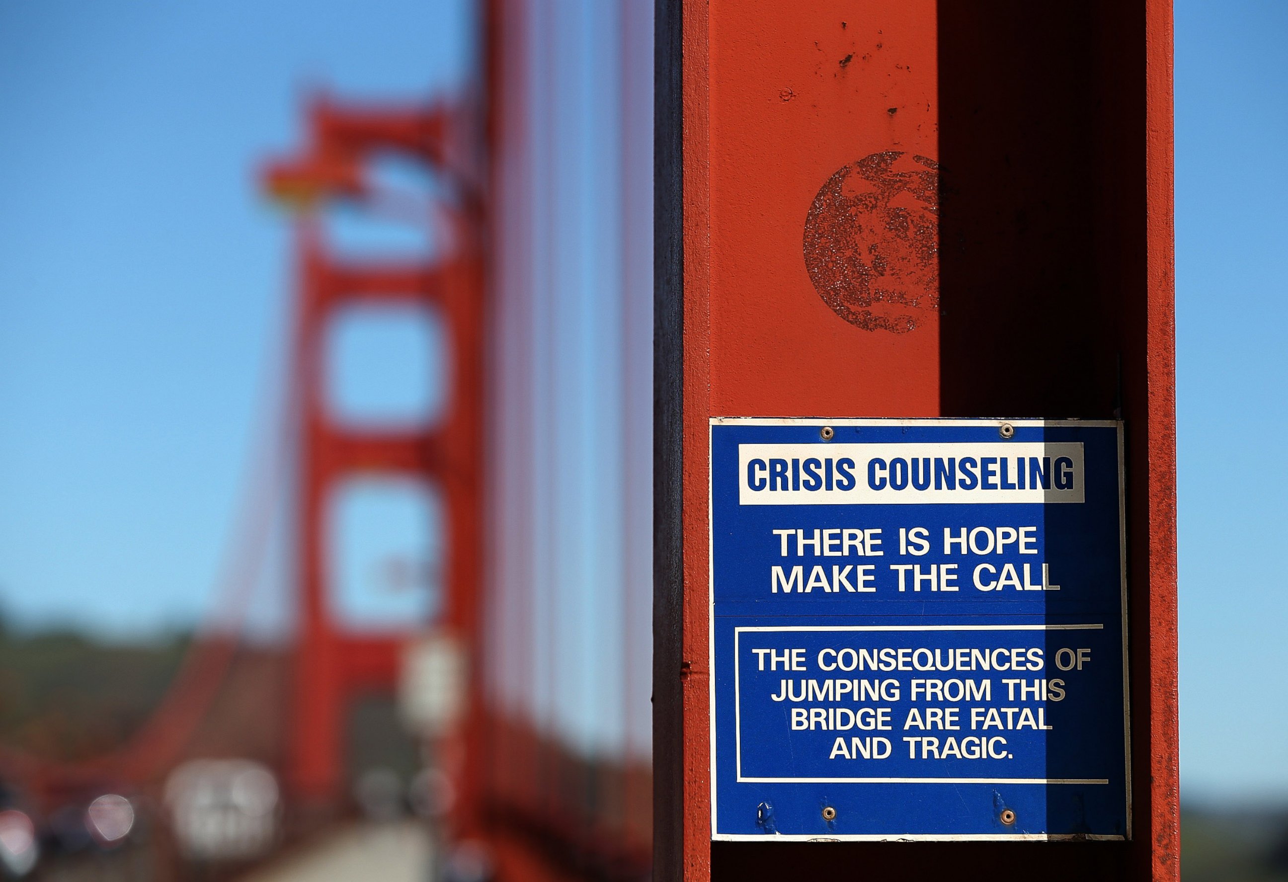 PHOTO: A sign is posted alerting people to use an emergency crisis counseling phone if in distress on the Golden Gate Bridge on March 12, 2014 in San Francisco, California. 