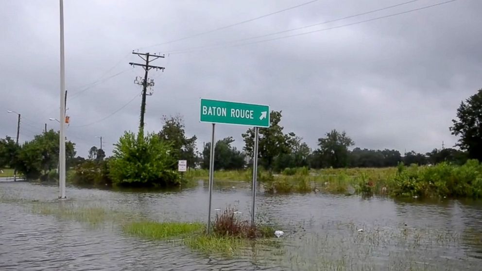 PHOTO: This Aug. 14, 2016 image from video provided by the Louisiana Army and Air National Guard shows floodwaters surrounding a road sign in Baton Rouge, Louisiana.
