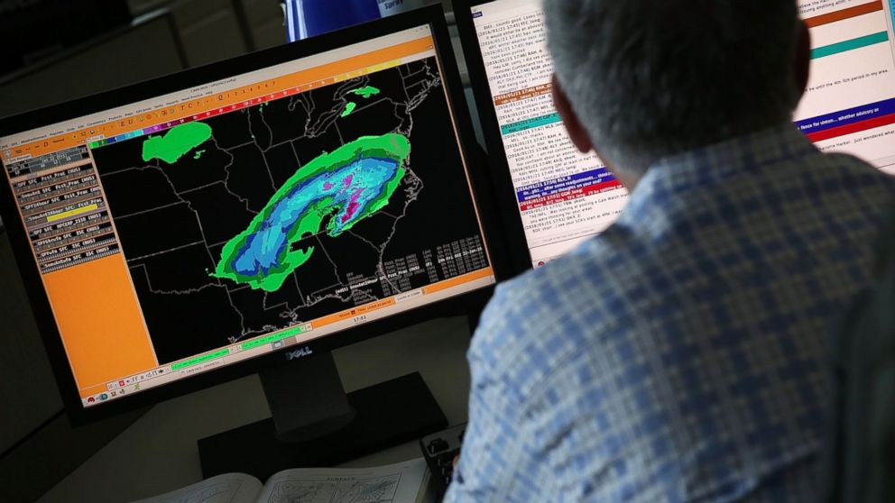  A forecaster at the NOAA Center for Weather and Climate Prediction in College Park, Maryland analyses data of an incoming winter storm January 21, 2016.