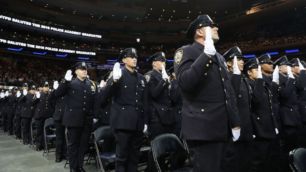 PHOTO: New members of New York City's police department's graduating class participate in a swearing in ceremony at Madison Square Garden on July 1, 2016 in New York City.