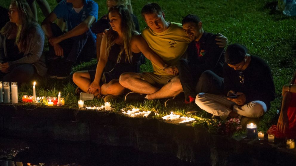 PHOTO: Mourners gather at Lake Eola for a candle light vigil for the victims of the terrorist massacre at the Pulse night club in Orlando on June 12, 2016.