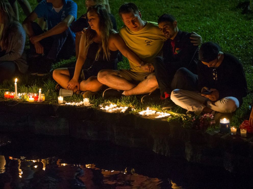 PHOTO: Mourners gather at Lake Eola for a candle light vigil for the victims of the terrorist massacre at the Pulse night club in Orlando on June 12, 2016.