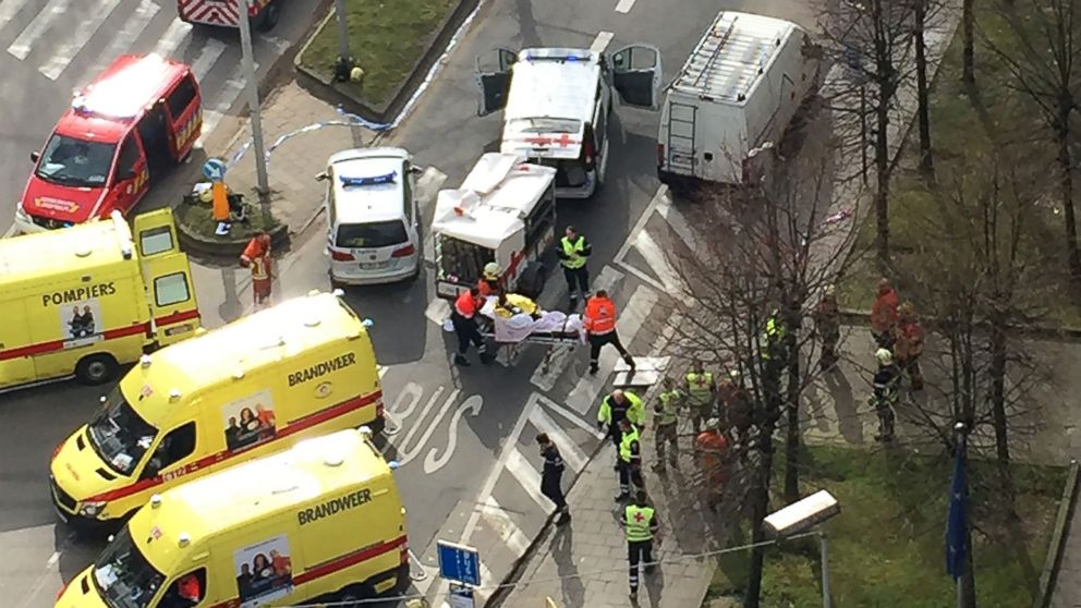 PHOTO: Rescue teams evacuate wounded people outside the Maalbeek metro station in Brussels on March 22, 2016 after a blast at this station located near the EU institutions.
