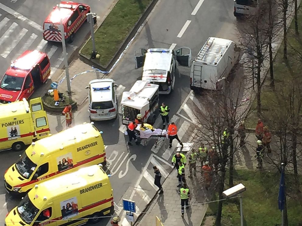 PHOTO: Rescue teams evacuate wounded people outside the Maalbeek metro station in Brussels on March 22, 2016 after a blast at this station located near the EU institutions.