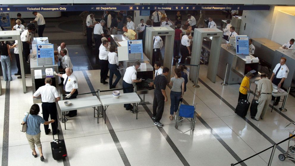 PHOTO: TSA agents shown working in Terminal 5/International Departures at O'Hare International Airport August 6, 2002 in Chicago, Illinois.