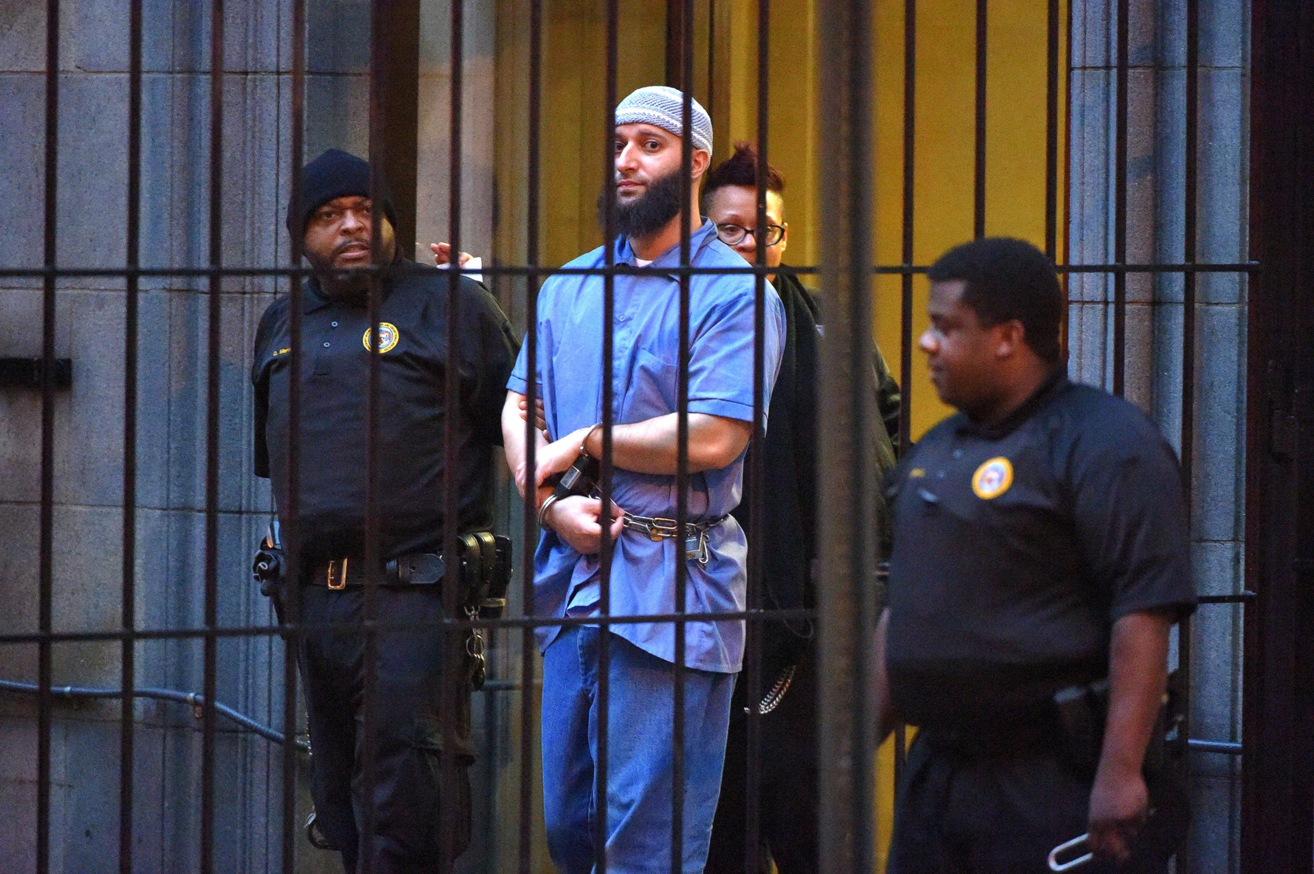 PHOTO: Officials escort "Serial" podcast subject Adnan Syed from the courthouse following the completion of the first day of hearings for a retrial in Baltimore, Feb. 3, 2016.
