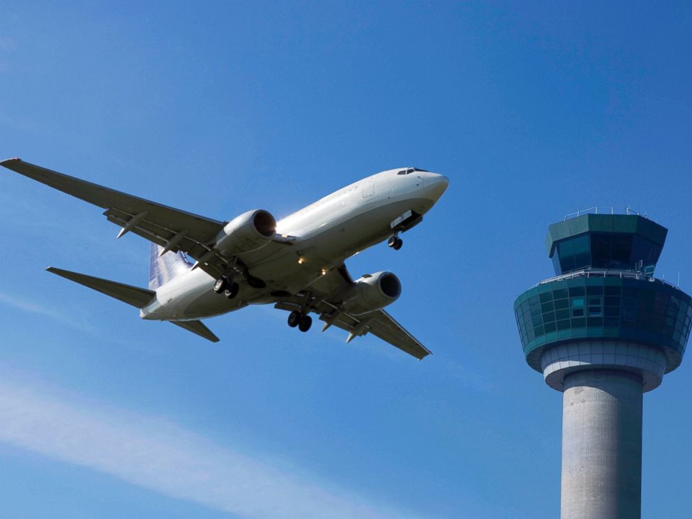 PHOTO: A plane flies past a control tower in this file photo.