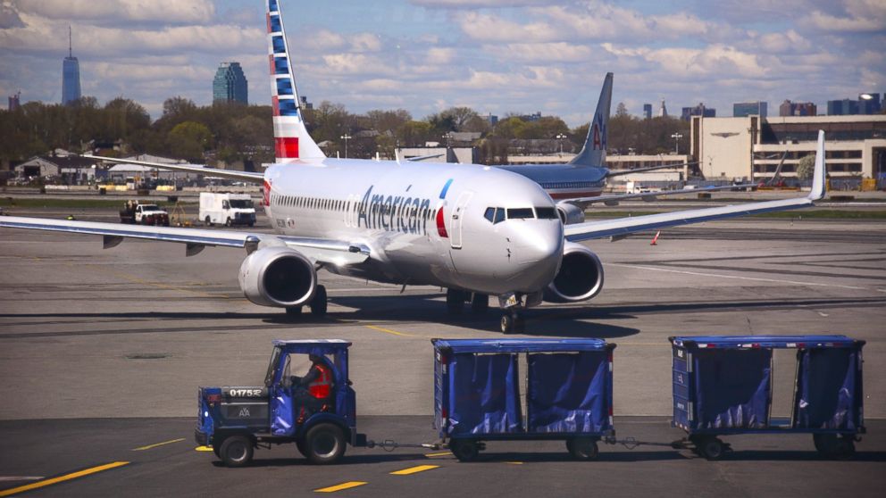 An American Airlines passenger aircraft arrives at the gate at LaGuardia Airport in New York, April 28, 2015. 