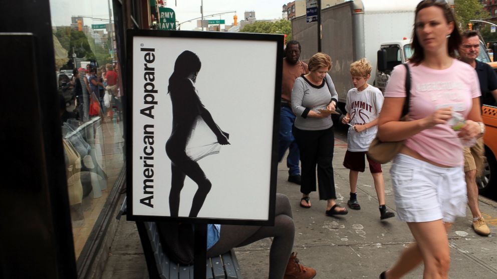 PHOTO: Pedestrians walk by an American Apparel retail store, Aug. 18, 2010, in New York.